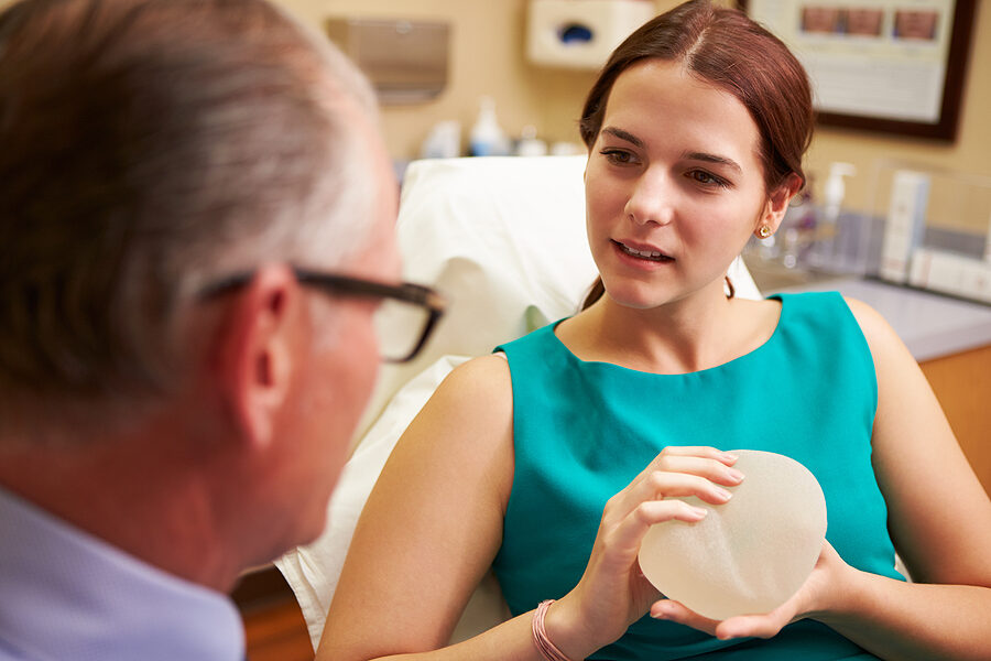 Woman Discussing customized treatment plan for Breast Augmentation With Plastic Surgeon